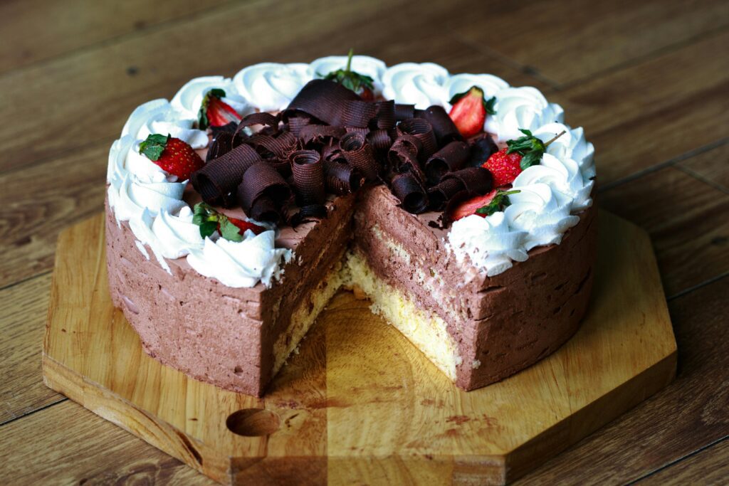 "Strawberry-flavored designer birthday cake with custom decorations."